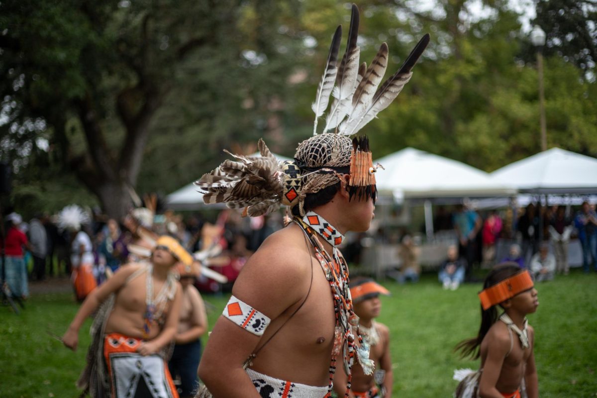 Sonoma County Youth Pomo Dancers form a large circle at SRJC Indigenous Peoples Day on Monday, Oct. 9, 2023 in Santa Rosa. 