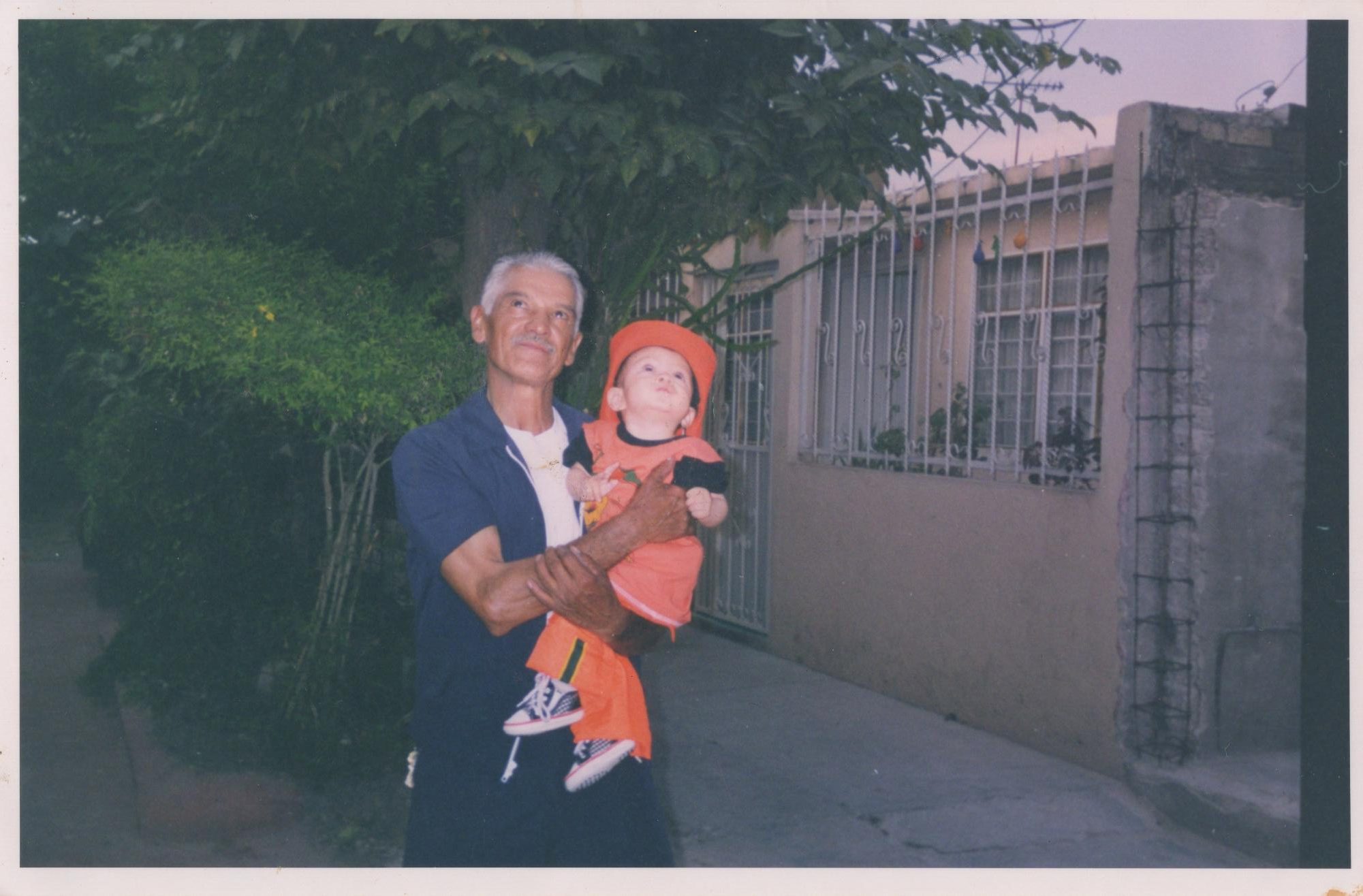 Max Millan’s abuelito, Gonzalo, a native of Toluca, holds him up as a toddler as they look towards an early 2000s Mexico City sky. Along with his wife, Millan’s abuelita Teresa, Gonzalo remains a fixture in his grandson's memories. From suffering from the vices of alcoholism to evolving into a faithful Christian, Gonzalo's life has inspired Millan, even more so now that he’s become his last living grandparent.
