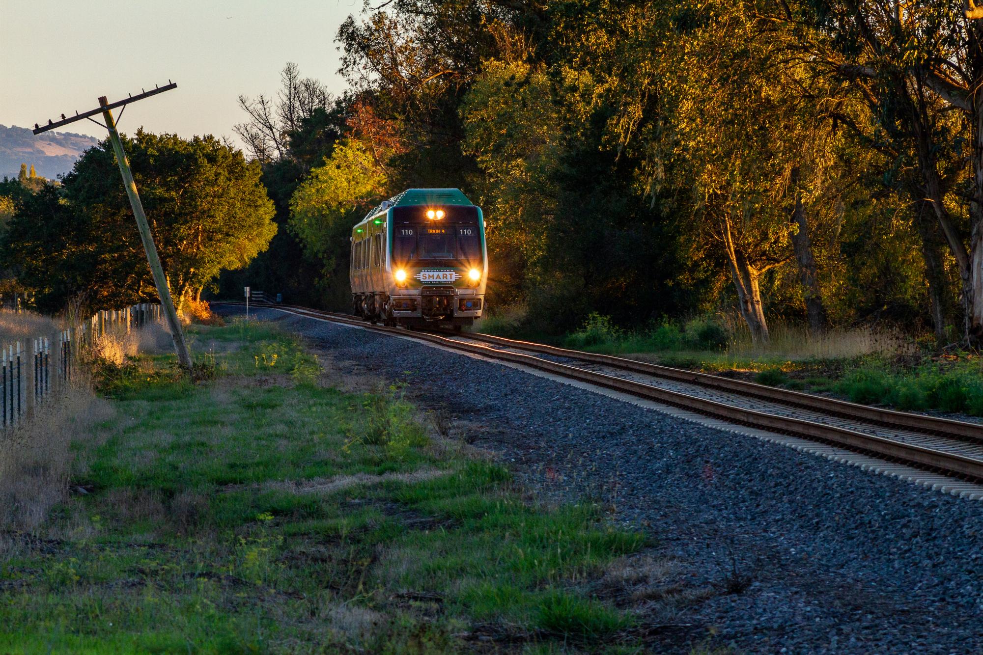 A signle SMART train car travels through the rural crossing between Cotati and Petaluma. My return journey on the train was filled with riders, including two boy scouts who sat across from me while I worked at one of the tables on the train. They got on the train in Marin and left at the downtown Petaluma stop. This area of the route seemed to have the most riders entering and exiting.