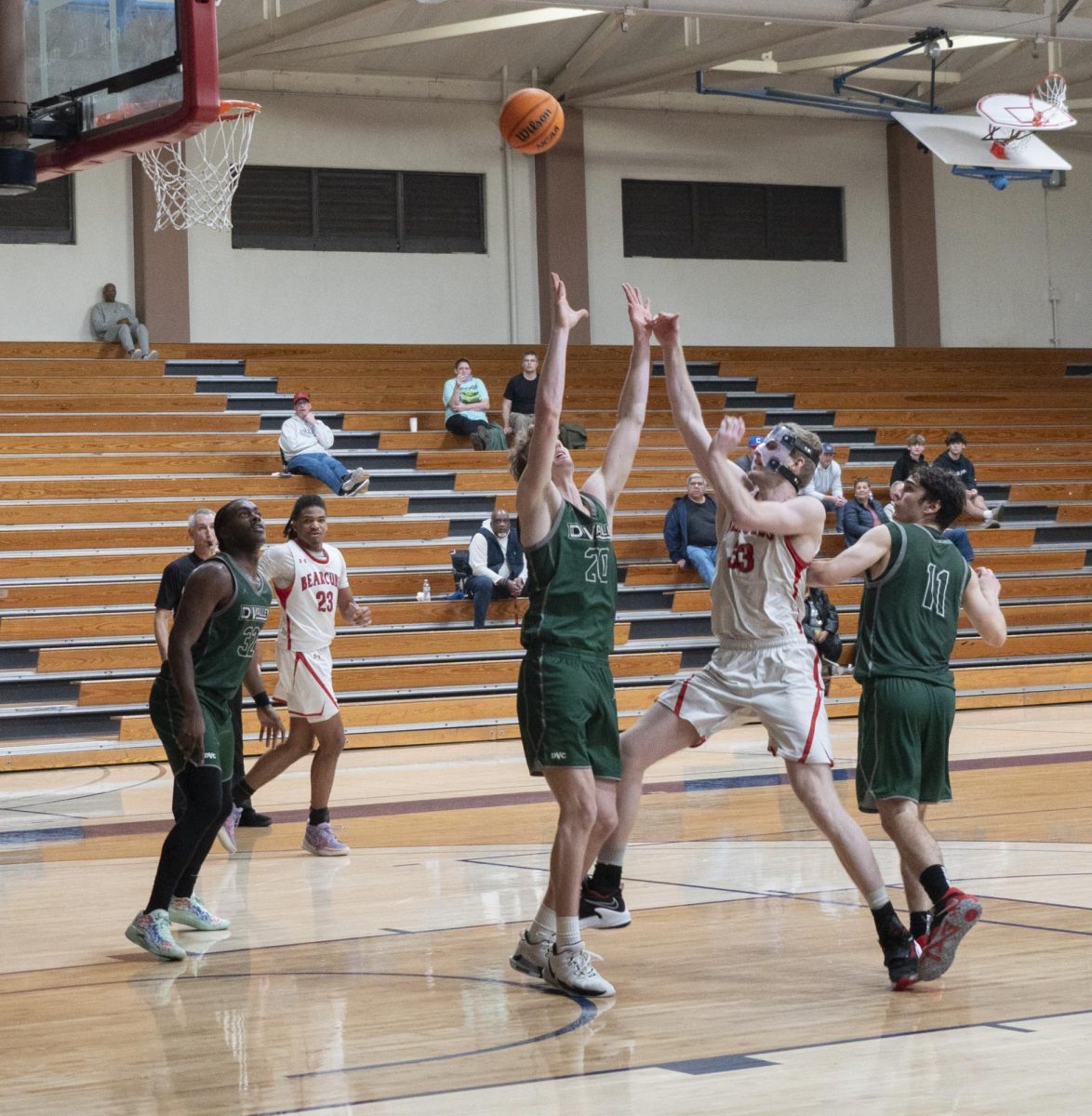 SRJC forward Justin Smith shoots a floater late in the game over Vikings forward Michael Wood in a conference matchup against Diablo Valley College at Santa Rosa's Haehl Pavillion Jan. 23, 2024
