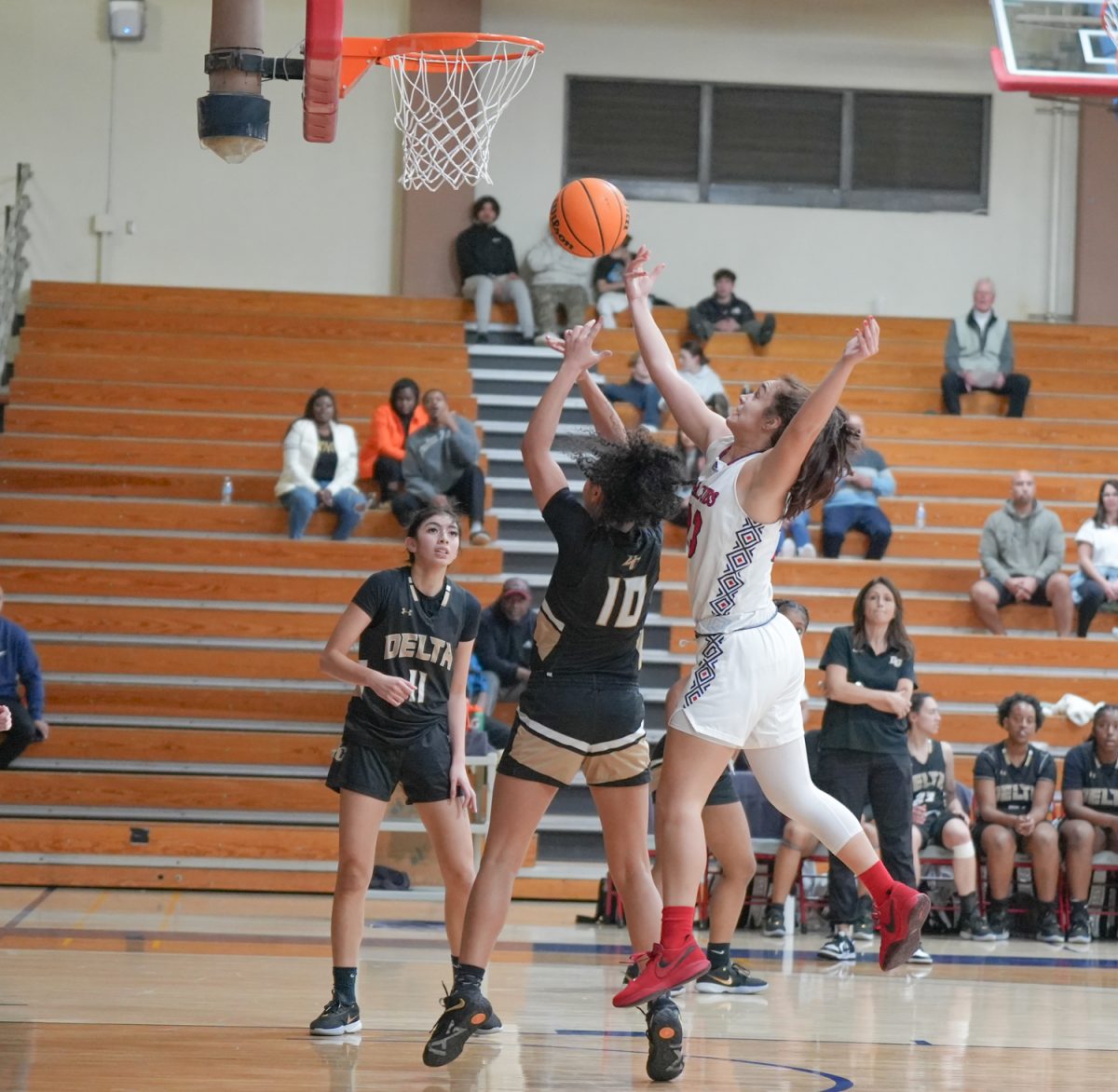 SRJC forward Ivy Gonzalez fights through some tough contact for a layup attempt at Santa Rosa’s Haehl Pavilion Feb. 2, 2024