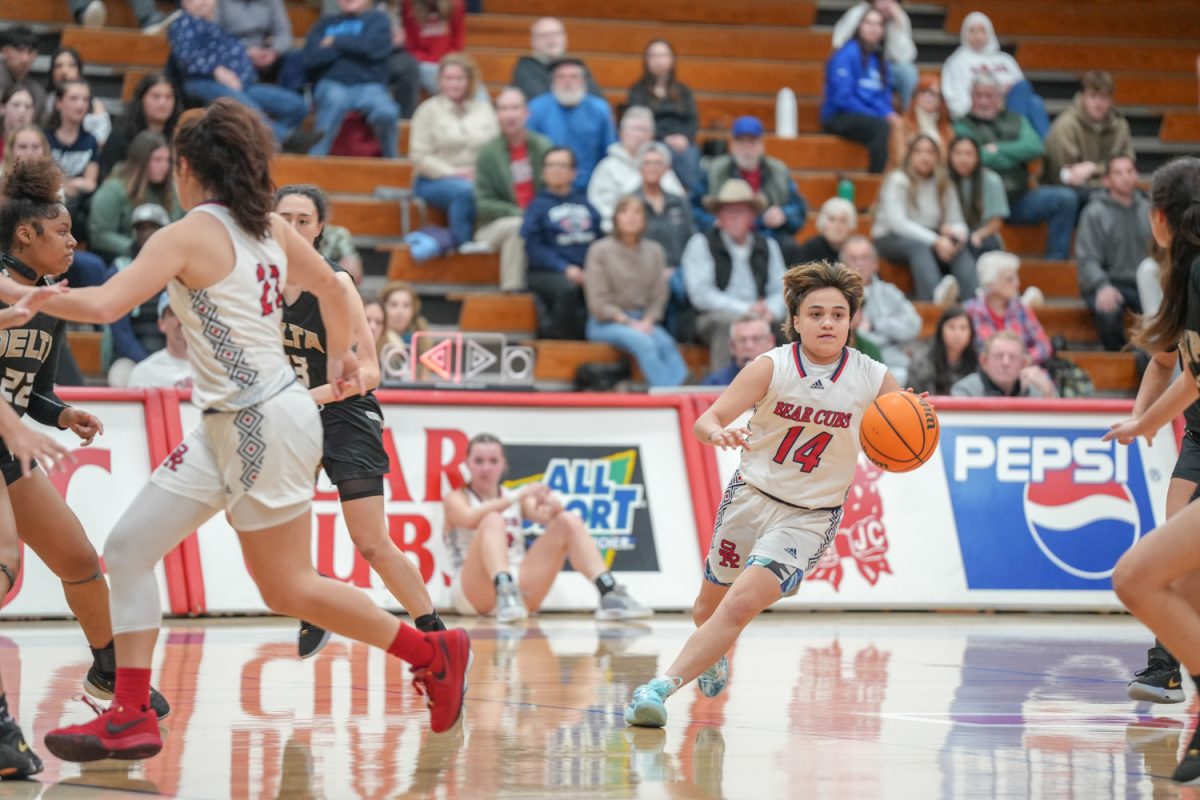 SRJC guard JJ Martinez takes the ball past half court at Santa Rosa’s Haehl Pavilion Feb. 2, 2024