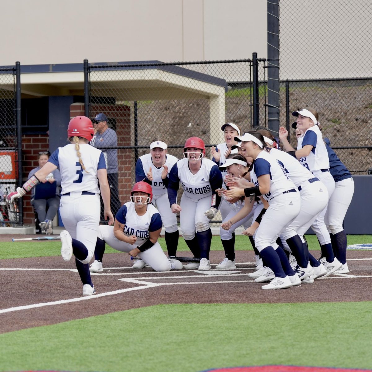 Adriana Novak joins in on the celebration at home plate following a two-run homer at Santa Rosa’s Marv Mayes Field Feb. 13, 2024.