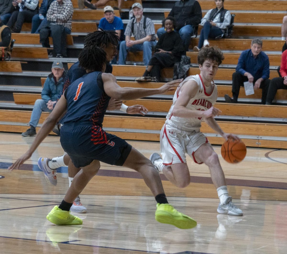SRJC Guard Jackson Smyth dribbles around two Cosumnes River College defenders at Haehl Pavillion on Tuesday Feb. 6.