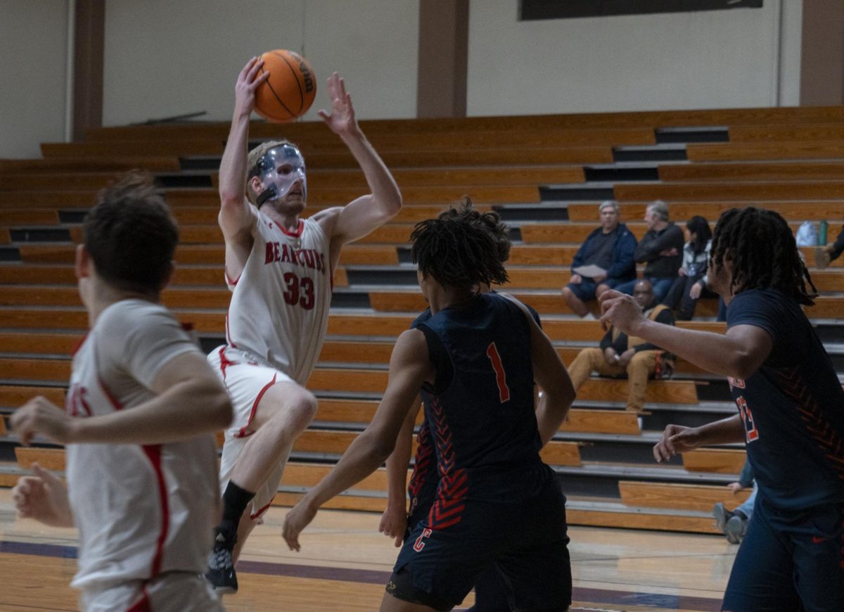 Bear Cubs forward Justin Smith rises up to finish at the rim against the Cosumnes River College Hawks at the Haehl Pavillion on Feb. 6.