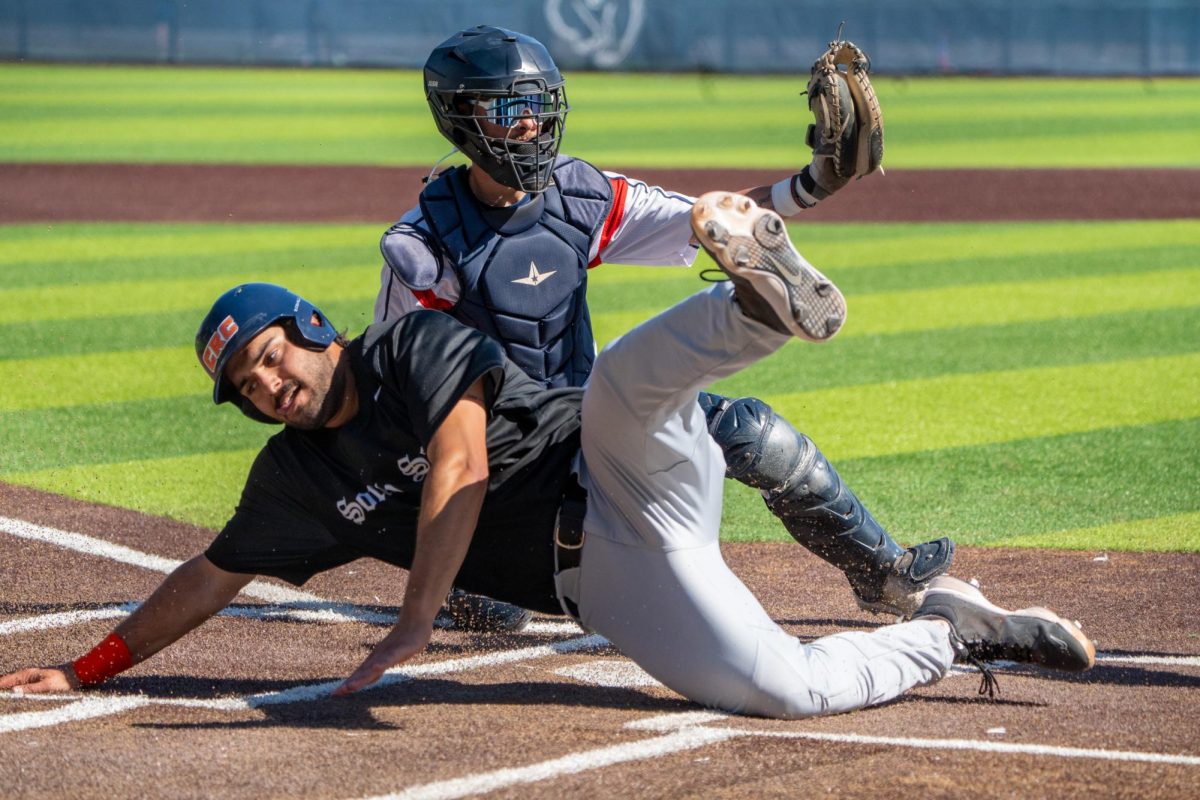 Catcher Cameron Duran tags Cosumnes River first baseman Ben Pernetti out at home plate in the top of the fourth inning at Santa Rosas Cook Sypher Field, March 26, 2024.