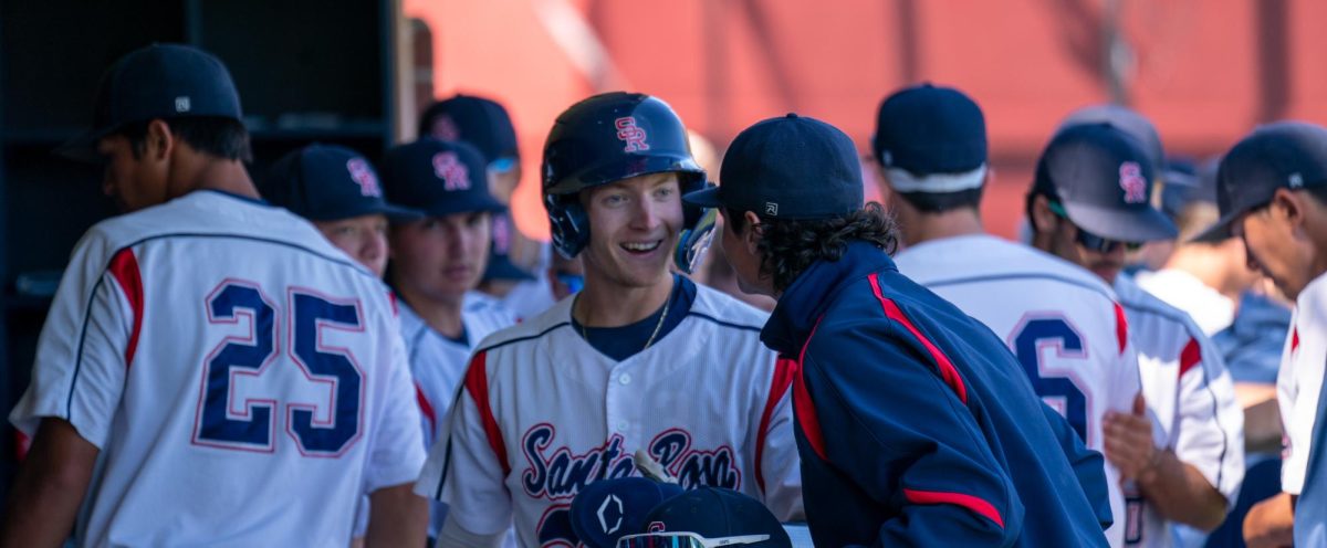 Bear Cubs infielder/pitcher Aidan Lombardi is all smiles after being knocked in by first baseman Josh Martin at the bottom of the first against Cosumnes River College on Tuesday, March 26, 2024 in Santa Rosa