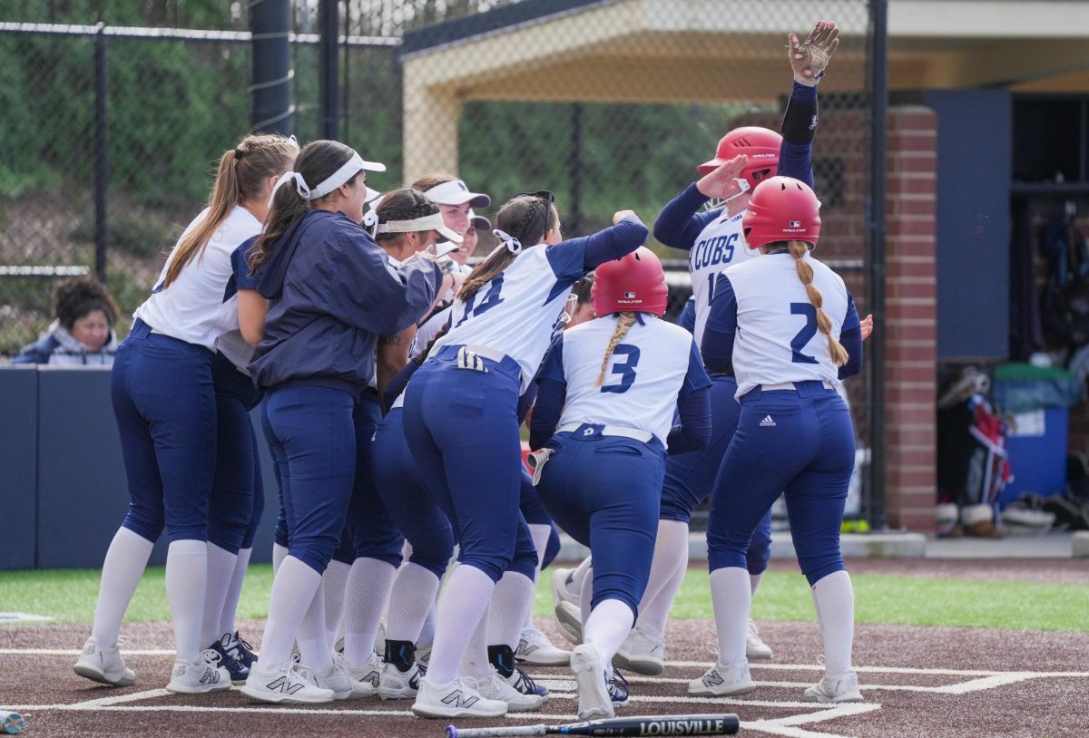 Catcher Haley Wyatt joins the rest of the team to celebrate a two-run home run at the bottom of the first inning, scoring two runs against Diablo Valley College at Santa Rosa’s Marv Mayes Field, Tuesday, March 12, 2024.