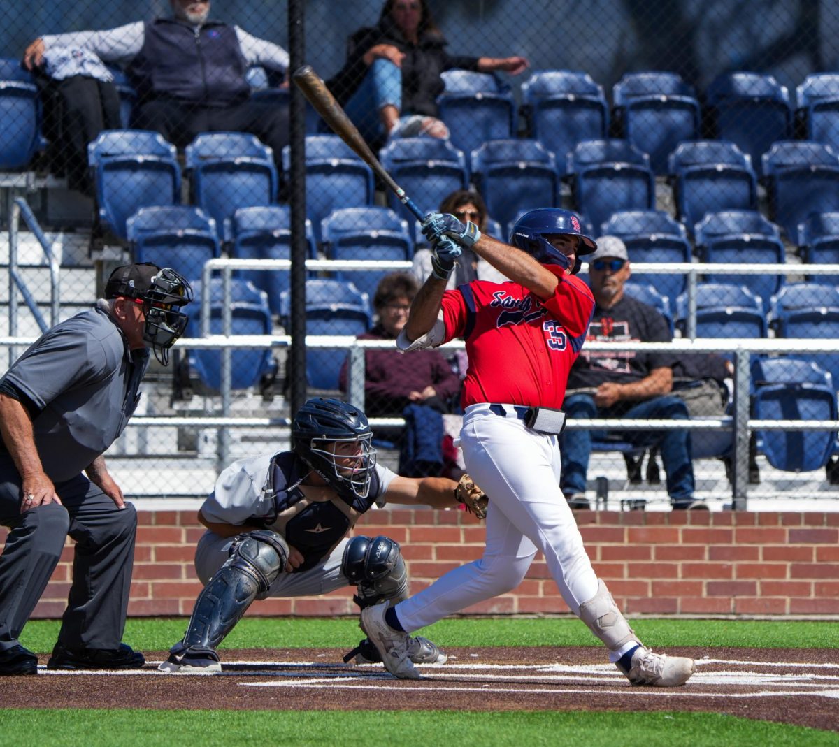 Josh Martin swings and hits a two-run home run to get the Bear Cubs started in the bottom of the first inning against Cosumnes River College at Santa Rosas Cook Sypher Field on Saturday, March 30, 2024.