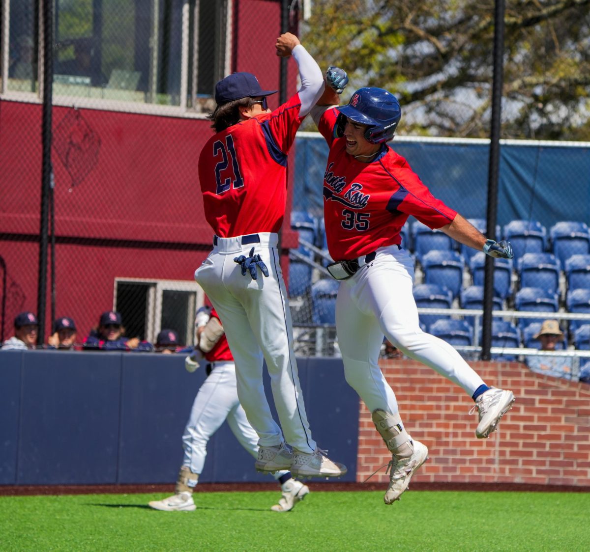 Josh Martin and Jordan Giacomini celebrate near the dugout after Martin's two-run home run in the bottom of the first inning against Cosumnes River College at Santa Rosa's Cook Sypher Field on Saturday, March 30, 2024. 