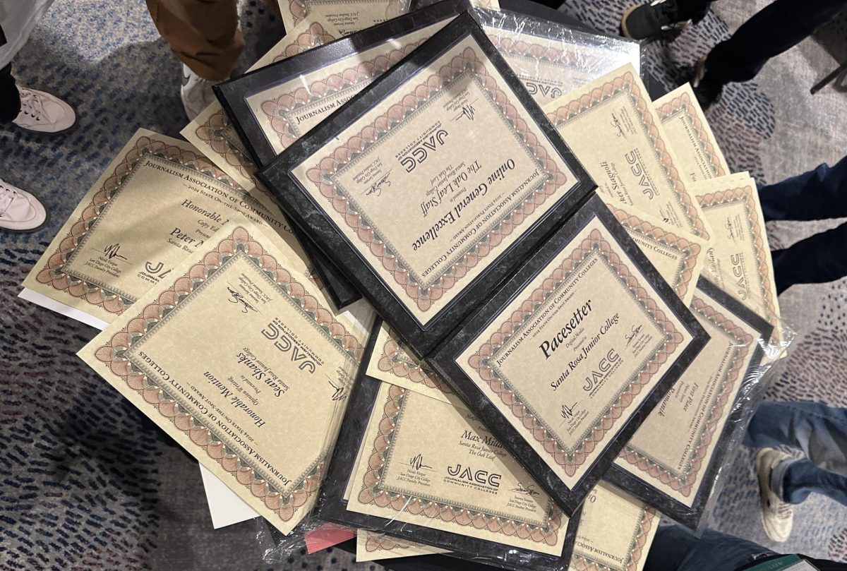A pile of plaques and certificates earned by the staff of the Oak Leaf during the Associated College Press 2024 Spring Convention Saturday, March 9, 2024.