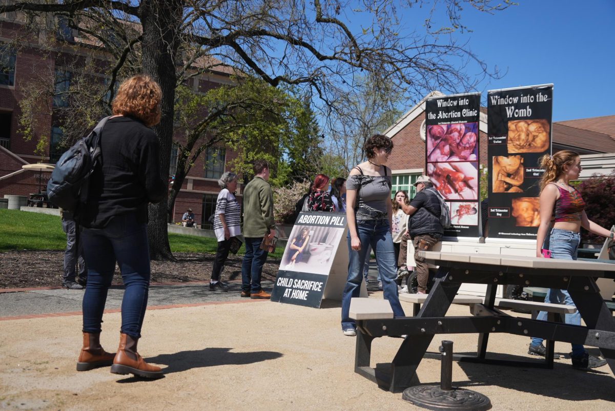 Anti-abortion group Project Truth displays graphic banners of mutilated fetuses and proselytizes against abortion, drawing a crowd of students on April 2 in Santa Rosa Junior College’s Bertolini Quad.