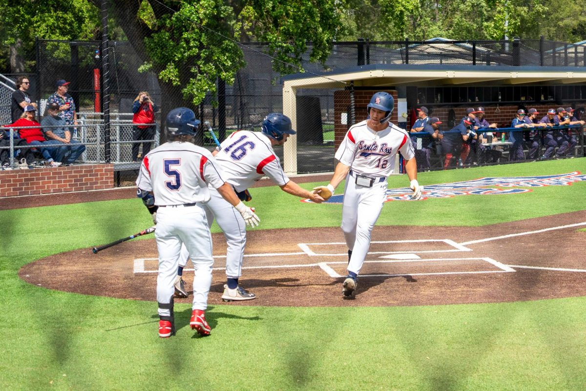 Outfielder Zane Bennett scores on catcher Cameron Duran's single to right field in the bottom of the fourth against American River College at Santa Rosa's Cook Sypher Field on Thursday, April 25, 2024.