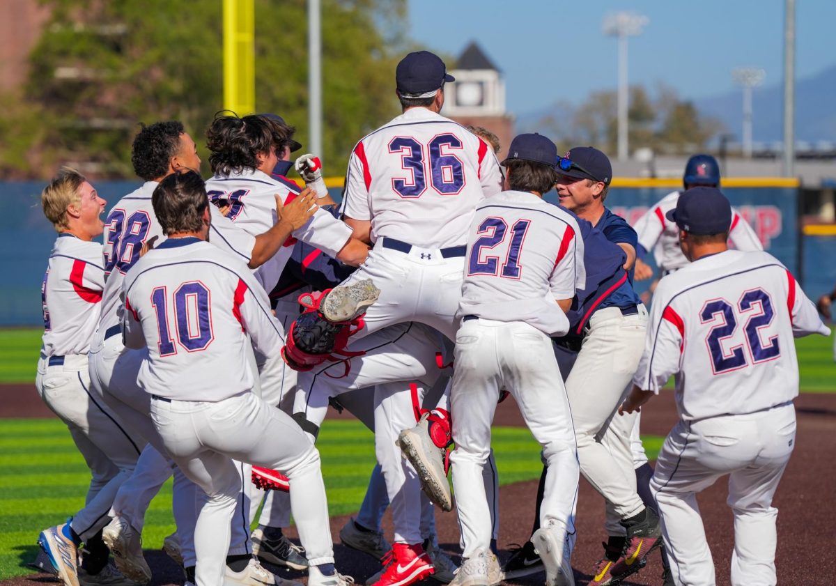Santa Rosa celebrates at first base after Henschel’s single to left field in the bottom of the ninth inning secures victory against San Joaquin Delta at Santa Rosa’s Cook Sypher Field on Tuesday, April 2, 2024.