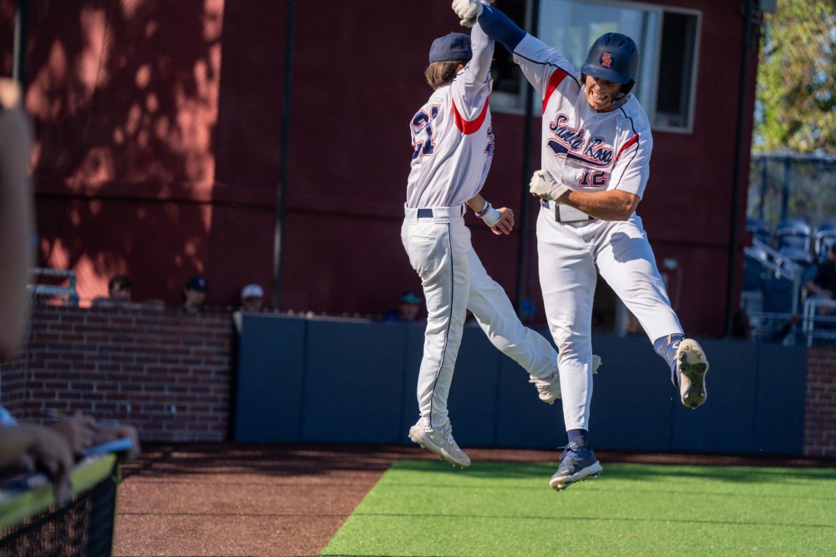 Zane Bennett, right, and Jordan Giacomini leap up in celebration after Bennett’s solo home run in the bottom of the eight inning against Modesto Junior College at Santa Rosa’s Cook Sypher Field on Thursday, April 11, 2024.