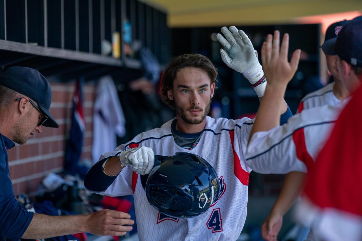 Bear Cubs catcher Cameron Duran picks up two hits and one RBI off five plate appearances against Modesto Junior College, shown here celebrating being knocked in by third baseman Keenan Morris on Thursday, April 11, 2024 in Santa Rosa.