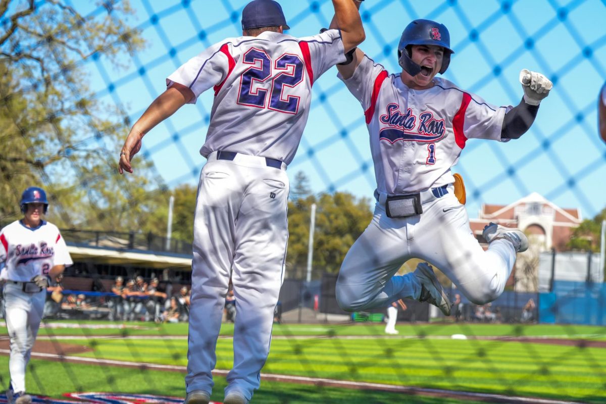 Alex Leopard, right, celebrates with Jacob Griener after he gets the ball rolling for the Bear Cubs with a two-run home run in the bottom of the fifth inning against San Joaquin Delta at Santa Rosas Cook Sypher Field on Tuesday, April 2, 2024.