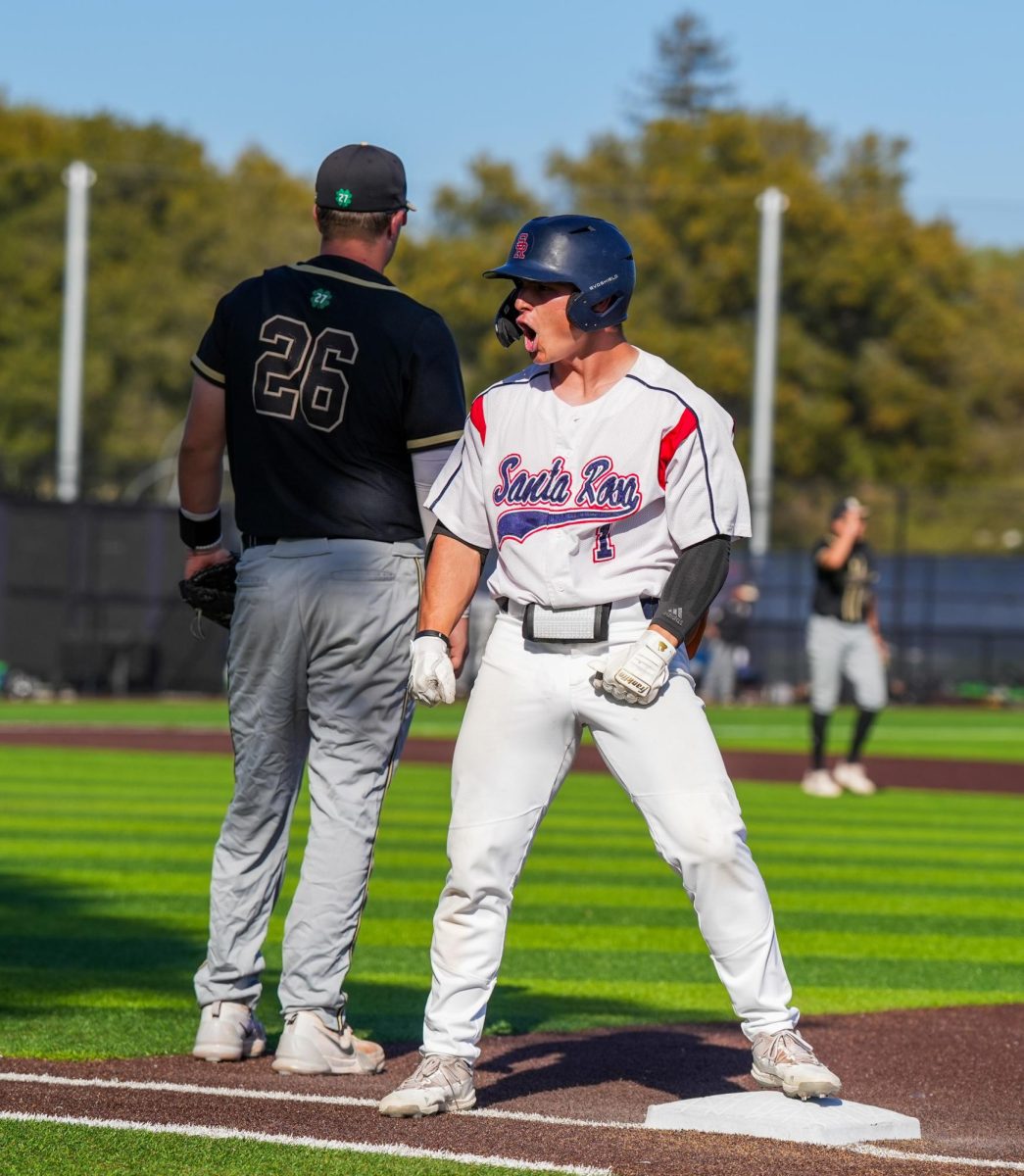 Alex Leopard celebrates at first base after hitting a single to right field against San Joaquin Delta at Santa Rosa’s Cook Sypher Field on Tuesday, April 2, 2024.