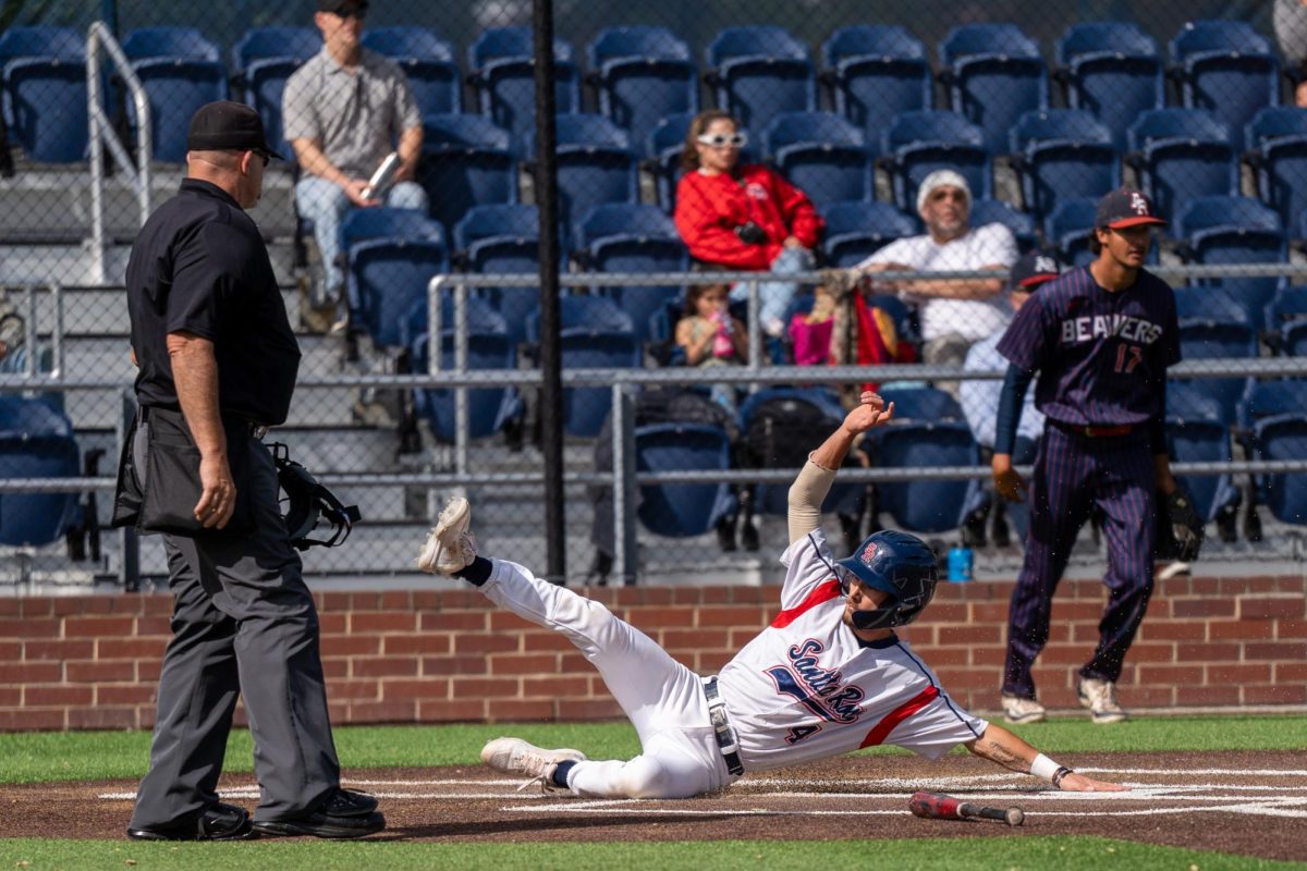 Catcher Cameron Duran slides home safely after third baseman Keenan Morris hits a single to right field in the bottom of the sixth against American River College at Santa Rosa's Cook Sypher Field on Thursday, April 25, 2024.