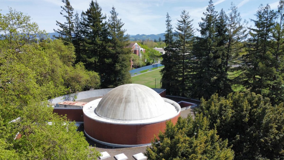 The exterior of the SRJC planetarium dome with Maggini Hall and the soccer fields in the background. The planetarium entered service in 1980 and closed in 2018.