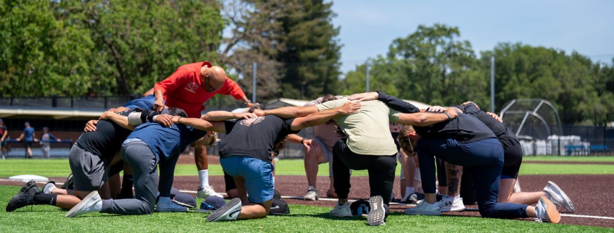 Assistant Coach Tom Francois prays one last time with the outgoing Sophomore players on Tuesday, May 14, 2024 in Santa Rosa.
