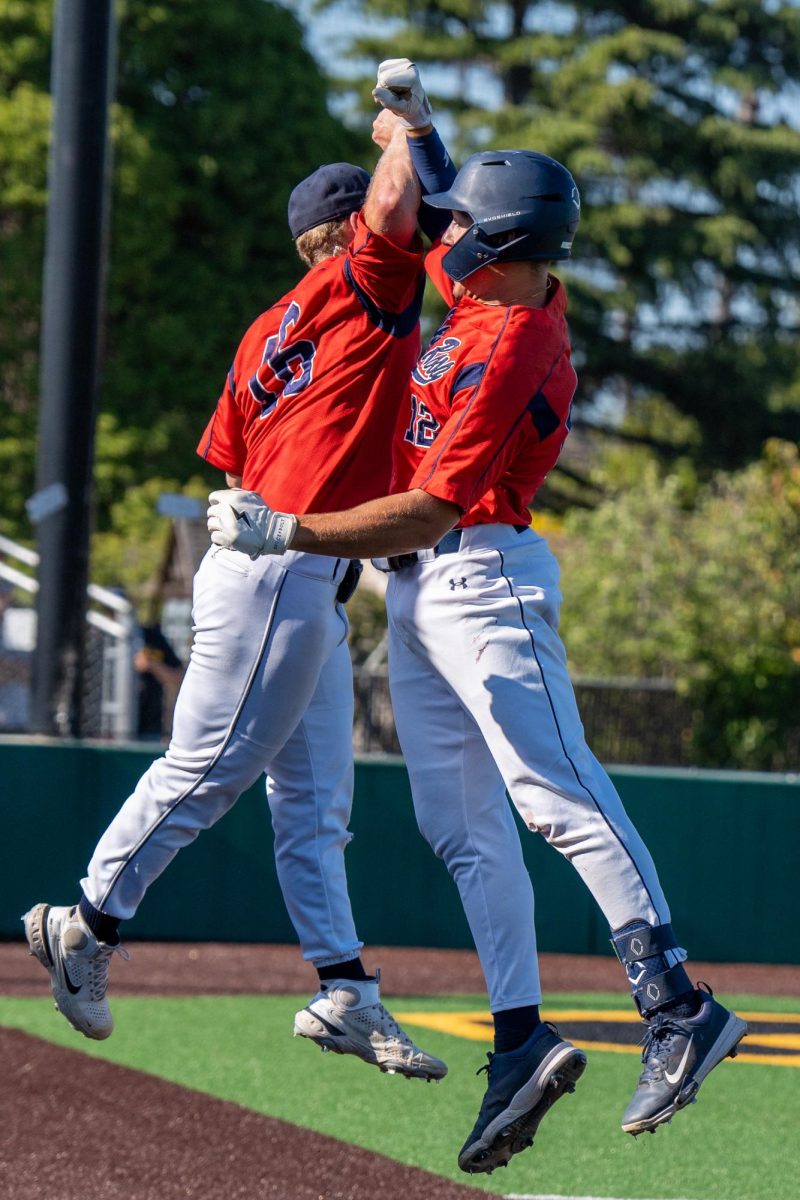 Left fielder Zane Bennett, right, celebrates with Jake McCoy after Bennett's solo home run against Chabot College in the second round of the CCCAA Super Regionals in Hayward on Thursday, May 9, 2024.