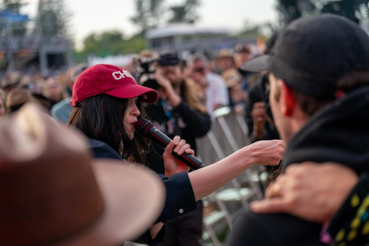 St. Vincent steals a fans "Chico" hat after running down the sound booth walkway at the JaM Cellars Stage at BottleRock Napa Valley on Friday, May 24, 2024.