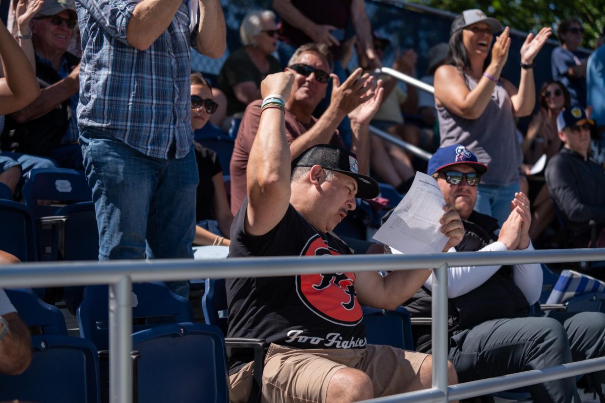 A fan whoops with excitement after Morris' grand slam in the bottom of the fourth against College of San Mateo in game 1 of the CCCAA Regional Playoffs at home on Thursday, May 2, 2024.