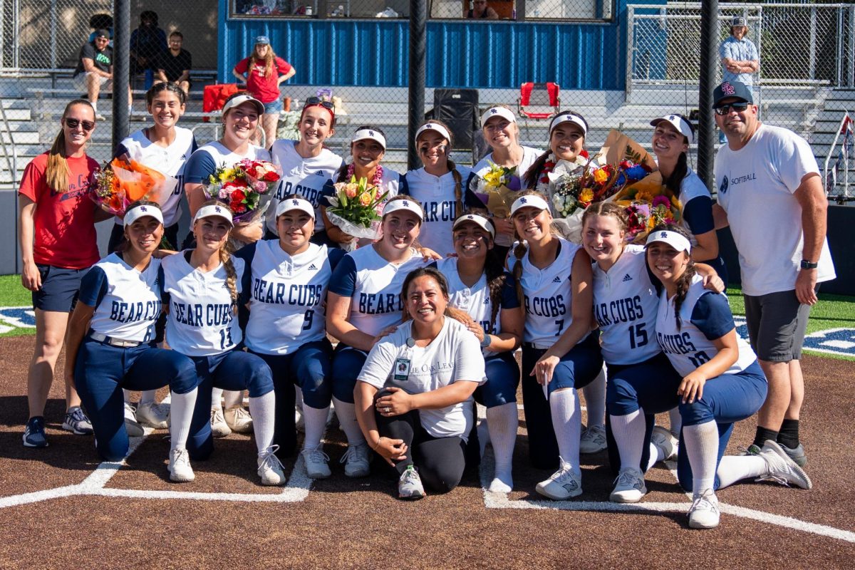 The SRJC Softball team poses with Yna Bollock at home plate at Santa Rosa's Marv Mayes Field on Saturday, April 20, 2024.