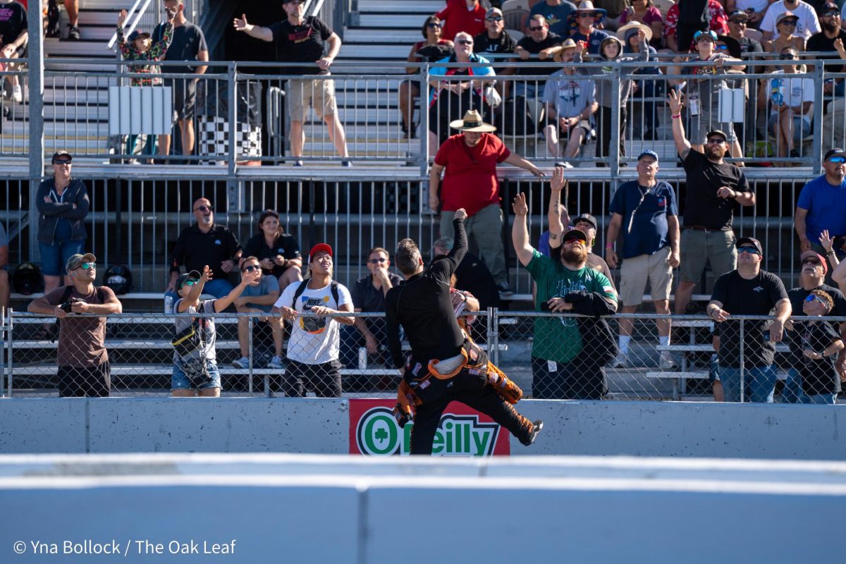 Funny Car driver Daniel Wilkerson is seen lobbing a t-shirt over Thunder Alley at the DENSO NHRA Sonoma Nationals on Friday, July 26, 2024 in Sonoma.