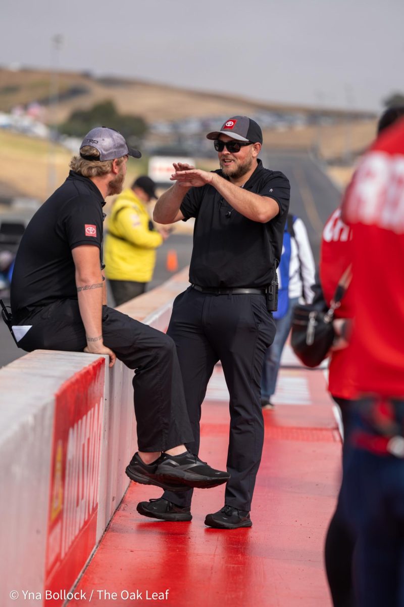 Members of the pit crew take a moment during the Seal Master NHRA Track Walk at the DENSO NHRA Sonoma Nationals on Sunday, July 28, 2024 in Sonoma. 