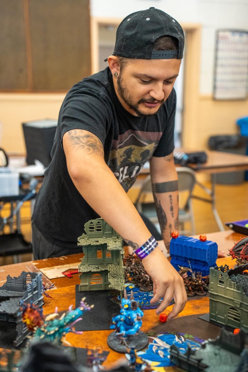 A participant for the "Warhammer 40k" tournament prepares to take their turn at Sonoma Con in Santa Rosa on Saturday, Aug. 31, 2024.