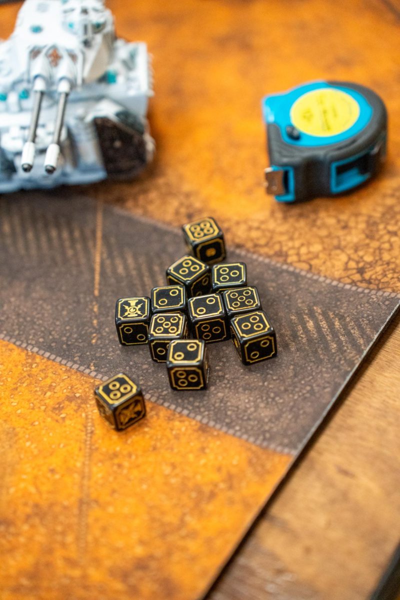 Dice and a measuring tape are among the supplies necessary to play "Warhammer 40k" at Sonoma Con in Santa Rosa on Saturday, Aug. 31, 2024.