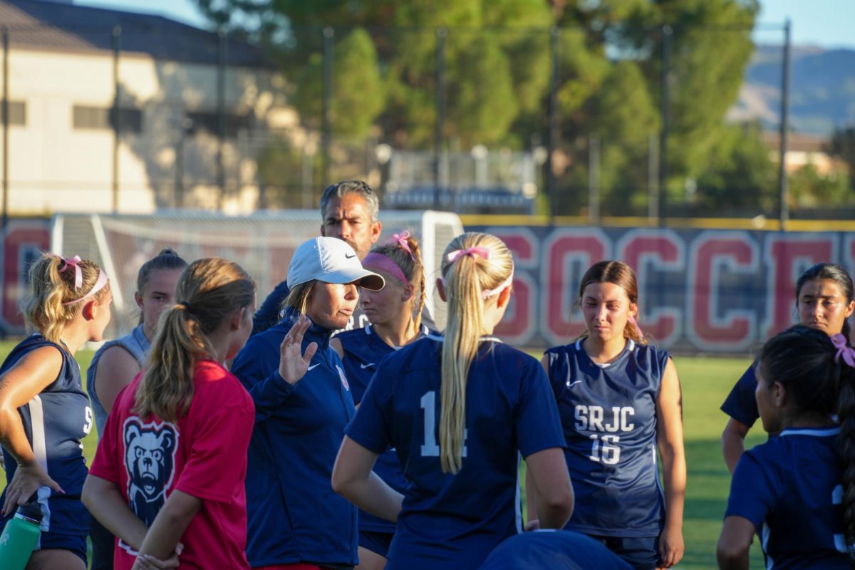 Santa Rosa’s head coach, Crystal Chaidez speaks to her team after a dominant win against American River College on Tuesday, Oct. 15, 2024.