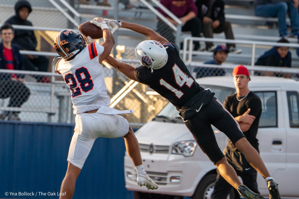 COS defensive back Louis Sanders intercepts a pass intended for SRJC's Joseph Campbell during the game at home against the College of the Sequoias on Friday, Oct. 11, 2024.