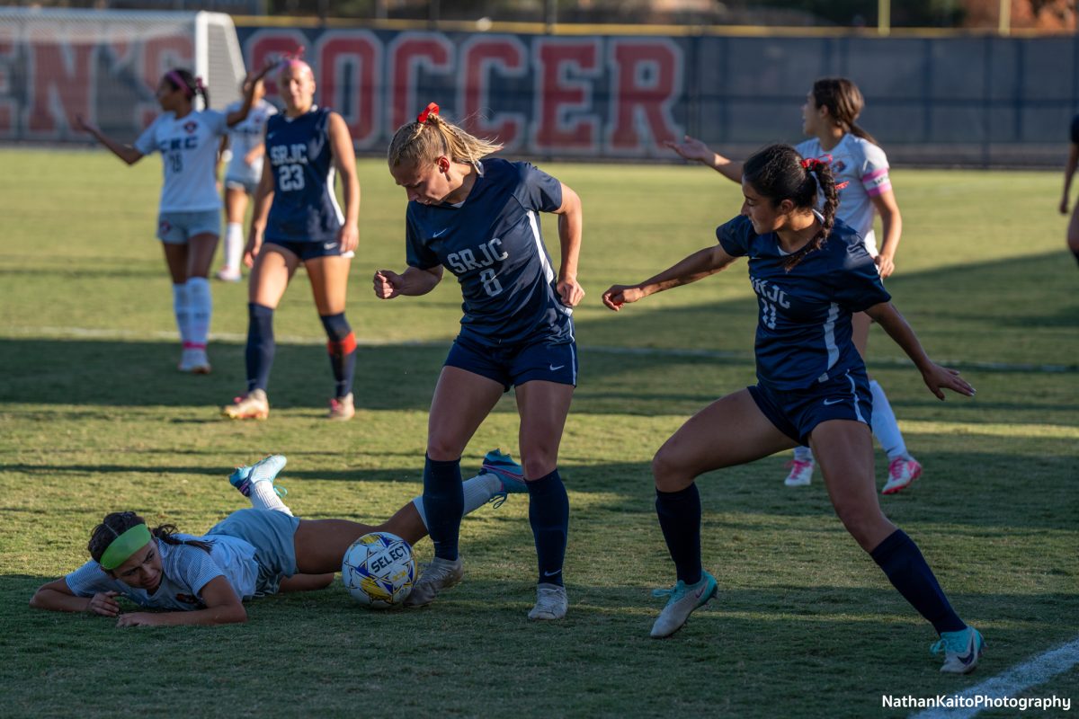 Santa Rosa’s forward Taylor Gandy, left, and midfielder Mia Carra, right, dispossesses Cosumnes River at home on Tuesday, Oct. 29, 2024. 