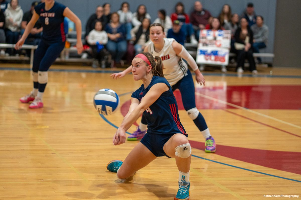 Santa Rosa’s outside hitter Madison Shaw drops low for a bump against American River at the American River gym on Tuesday, Nov. 26. 