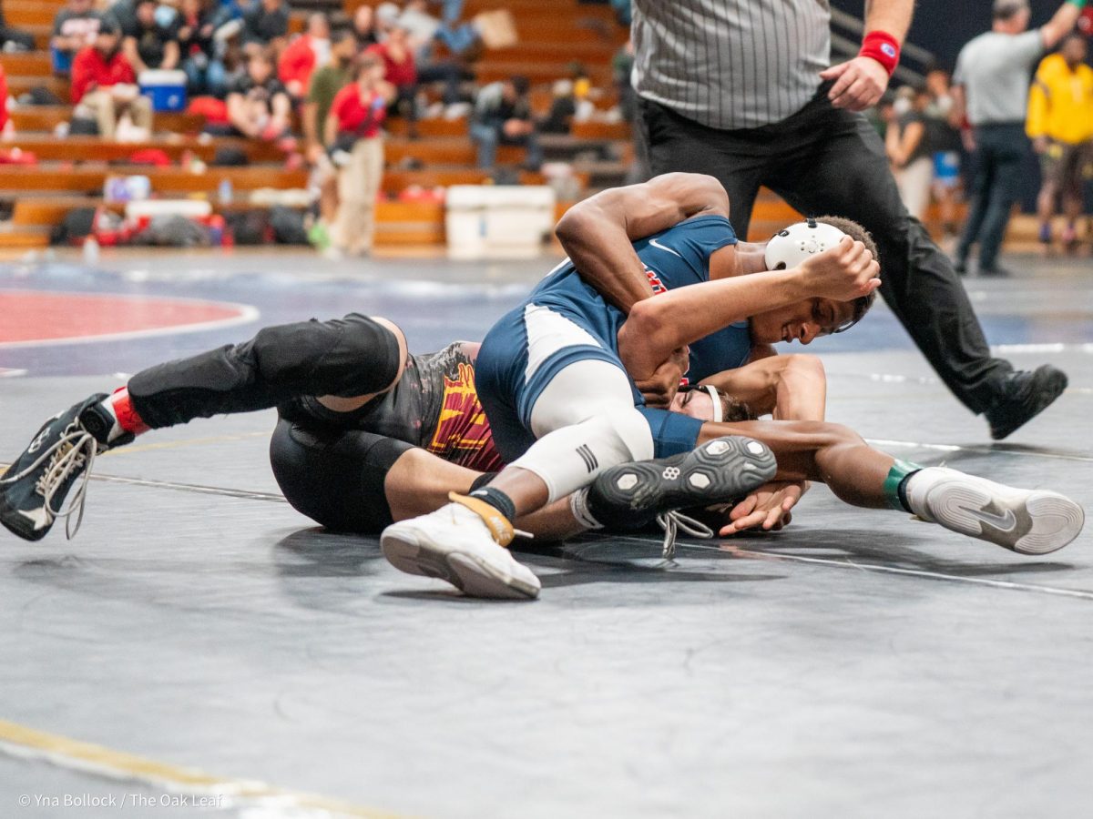 Bear Cub Derek Ruffin (125) locks in on College of the Redwood's Dakota Sanders in the quarterfinals of the CCCAA Norcal Regional Championships in Haehl Pavilion on Saturday, Dec. 7. Ruffin beats Sanders by decision, 10-9.