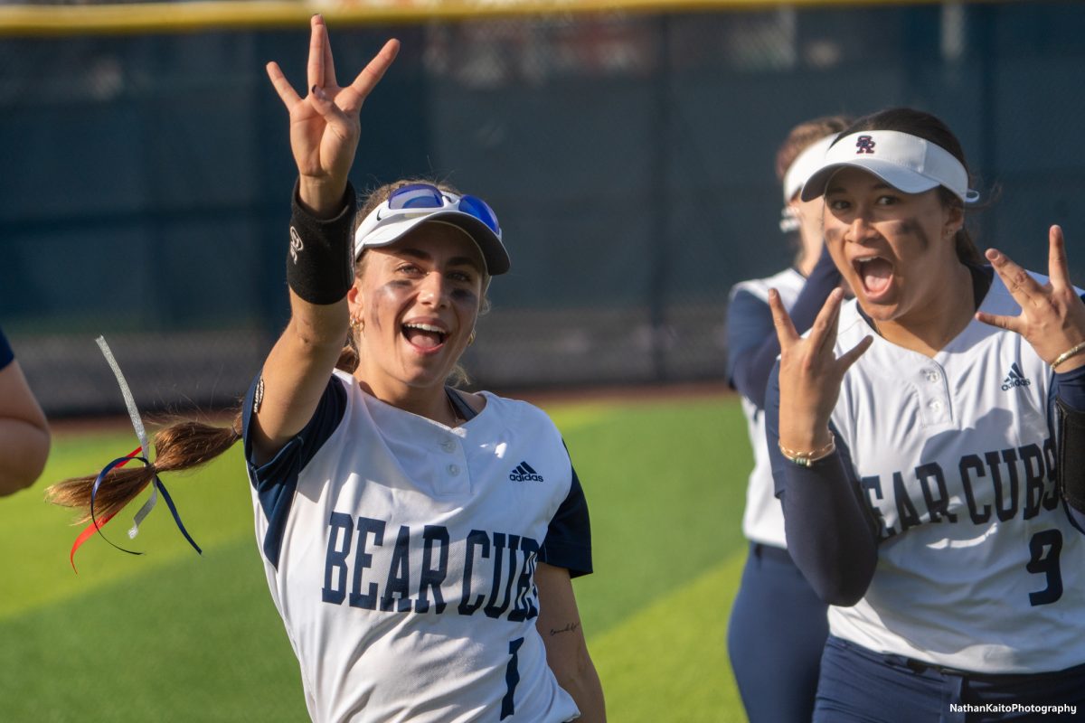 Bear Cubs right fielder Kali Garcia and second baseman Niueni Elisara hold up “W”s after winning game one against Hartnell on Friday, Jan. 24th, 2025. 