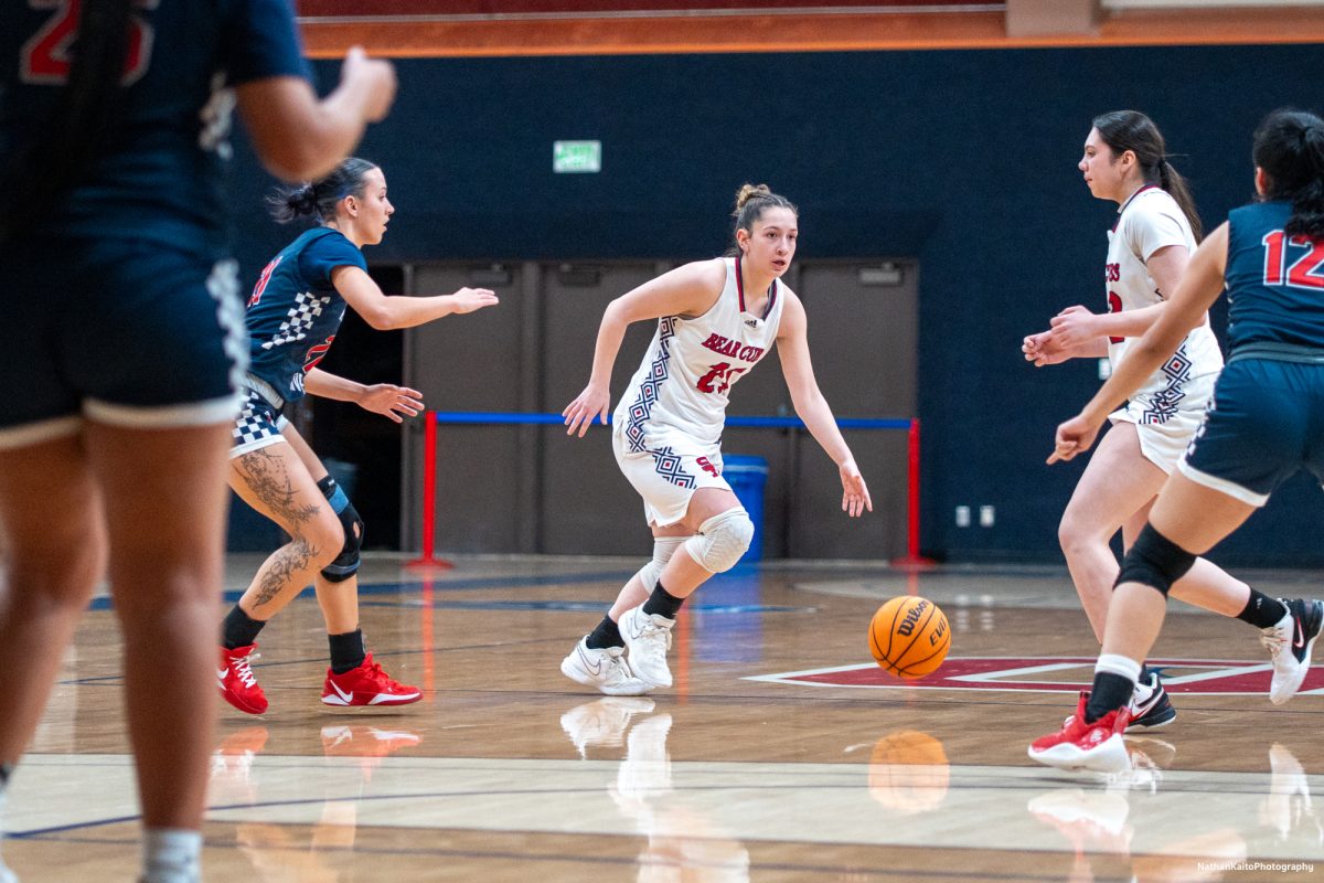 Bear Cubs' guard Hailey Webb looks to build an attack against American River as forward Natalie Royer sets a screen at Haehl Pavilion on Friday, Feb. 21, 2025.