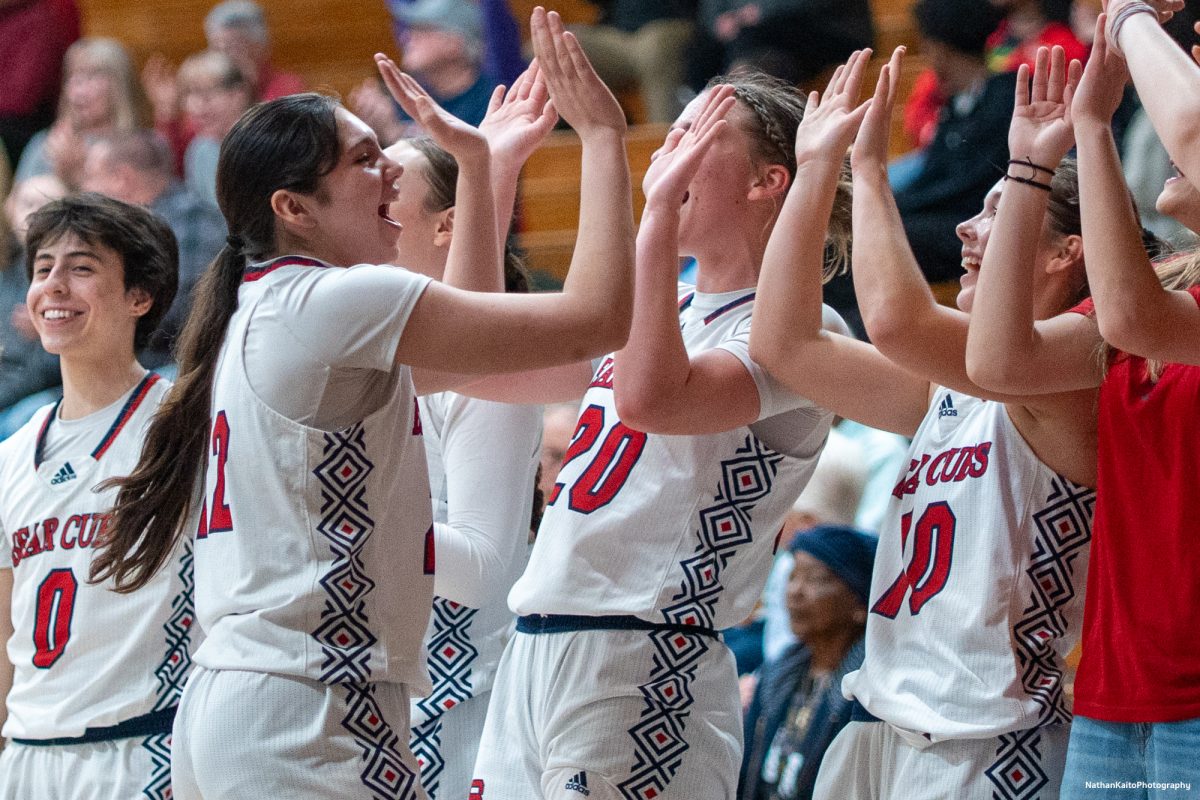 SRJC's forward Natalie Royer runs down the bench and high-fives everyone after an Ivy Gonzalez three pointer against Haehl Pavilion at Haehl Pavilion on Friday, Feb. 21, 2025.