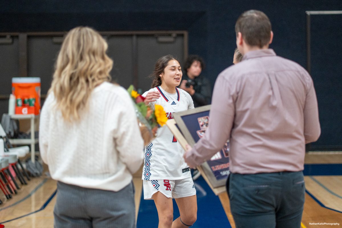 Bear Cubs' guard Lindsey Arellano is all smiles as she recieves her recogniziton fro two seasons of service to SRJC before their game against American River at Haehl Pavilion on Friday, Feb. 21, 2025.