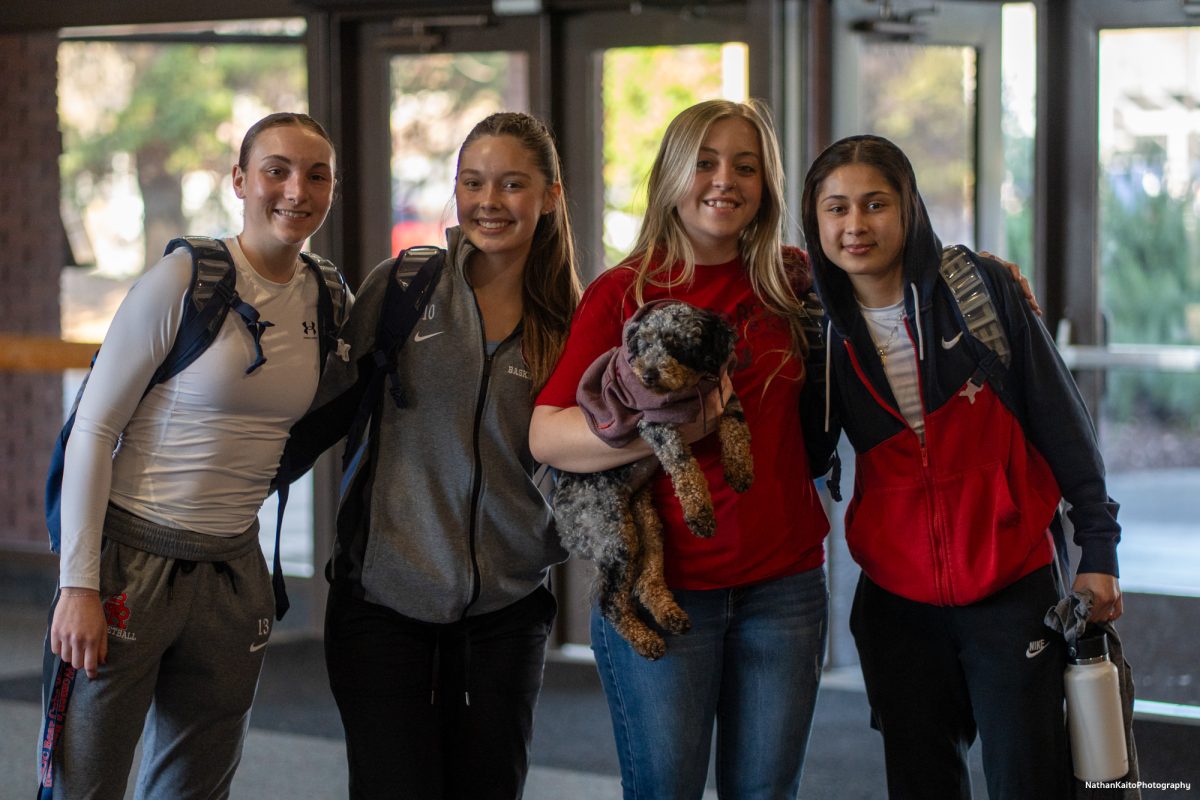 Left, Caitlin Baldwin, center, left, Sahsta Vlasak, center right, Bennett Gaylord, and right, Lindsey Arellano arrive at Haehl Pavilion prior to their game against American River on Friday, Feb. 21, 2025.