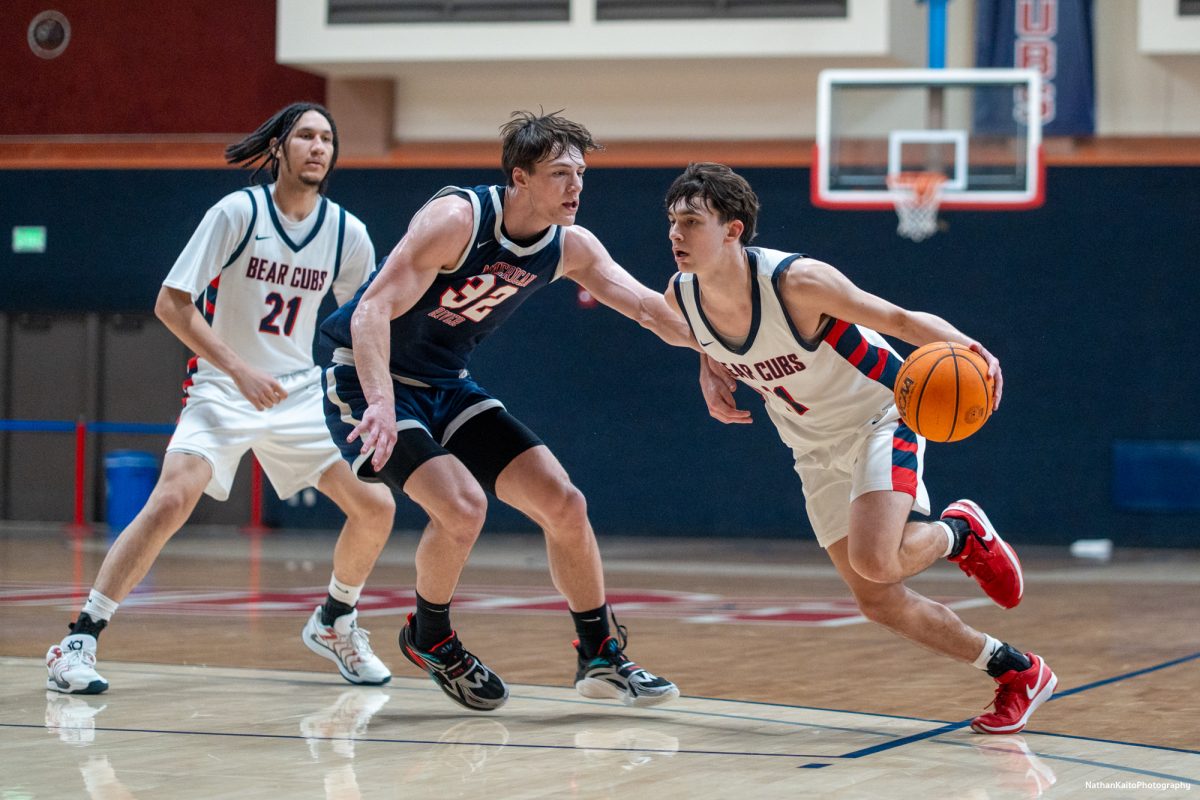 Bear Cubs' guard Spencer Langowski charges at the Beavers' Max Manfredi at Haehl Pavilion on Friday, Feb. 21, 2025.