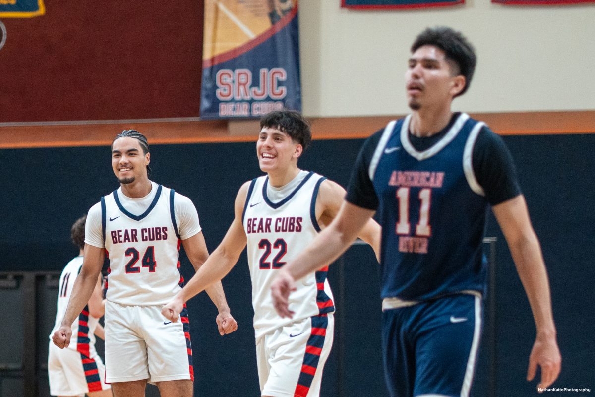 Bear Cubs' forward Vincent Jackson and guard, Andrew Pengel celebrate while the Beavers' guard Ivan Soto looks on in defeat at Haehl Pavilion on Friday, Feb. 21, 2025.