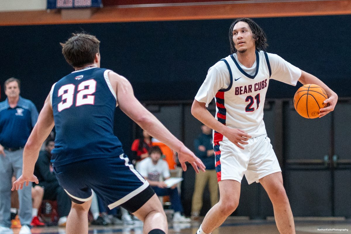 Bear Cubs' forward Tayden Collins sizes up the Beavers' forward Max Manfredi at Haehl Pavilion on Friday, Feb. 21, 2025.