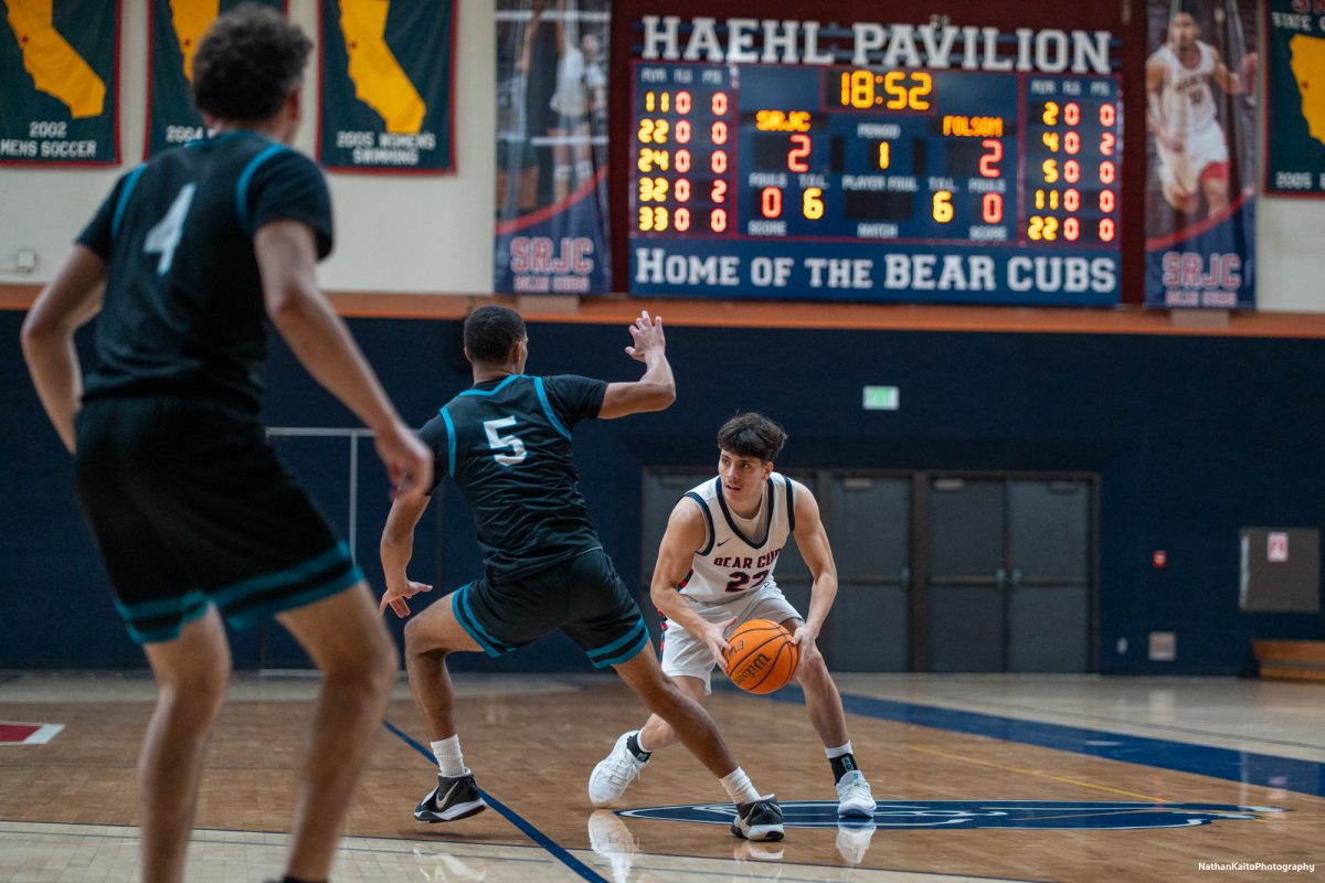 Bear Cubs' guard Andrew Pengel squares up with Folsom Lake's Micah Hobson at Haehl Pavilion on Friday, Feb. 14, 2025. 