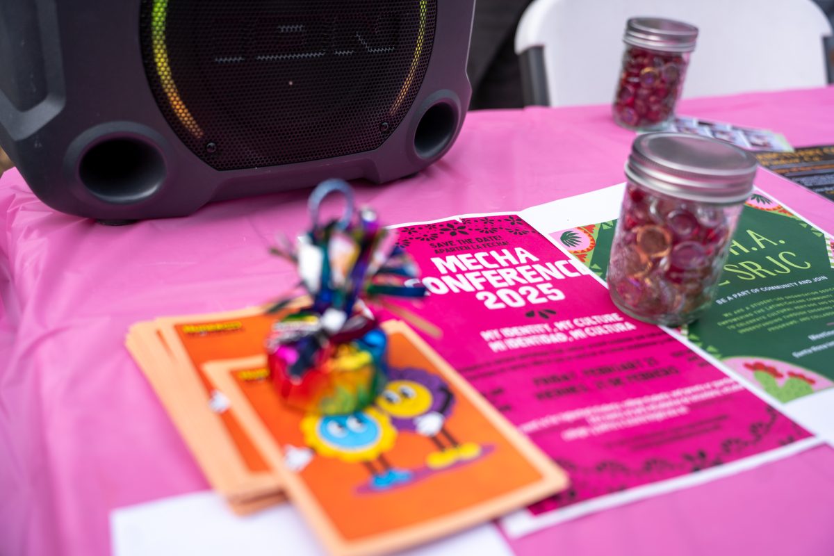 Flyers for MEChA, a chicano student organizaiton, sit atop a booth at the financial aid fun fair outside of Plover Hall on Wednesday, Feb. 12, 2025.