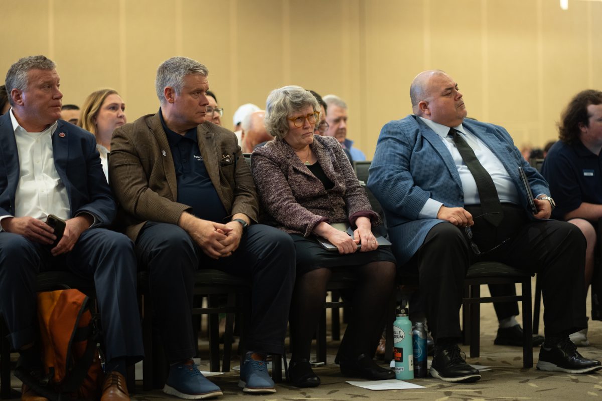 Attendees wear solemn faces as Interim President Emily Curter addresses the crowd at Sonoma State University on Friday, Feb. 21, 2025.