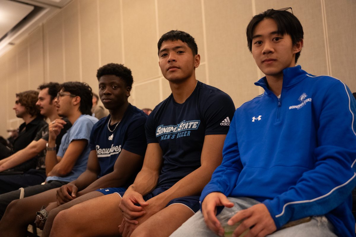 Sonoma State University soccer players (L-R) Isaac Bandabaila, Cypress Navarro-Acio, and Brian Chang sit in attendance for the state legislative forum at Sonoma State University on Friday, Feb. 21, 2025.
